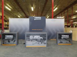 Custom Gravitee Modular Inline Exhibit with SEG Fabric Graphics, (3) Monitor Mounts, Closet Storage, (2) MOD-1509 Backlit Counter with Locking Storage, and (1) Custom Backlit Counter with Wireless Charging Pads -- View 2